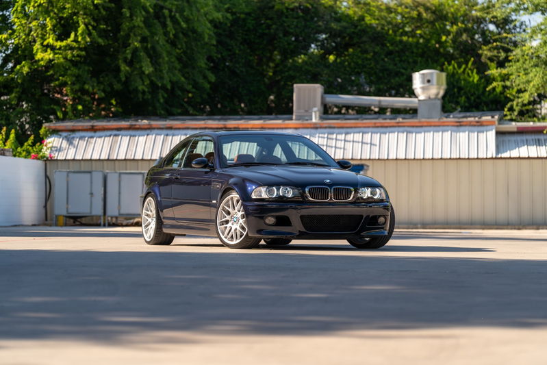 2002 BMW M3 in Carbon Black. Features silver multi-spoke rims and sleek, sporty body trim.