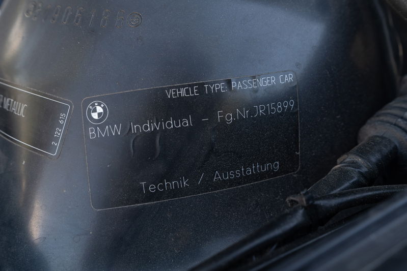 Close up of BMW Individual VIN sticker on a Carbon Black 2002 M3.