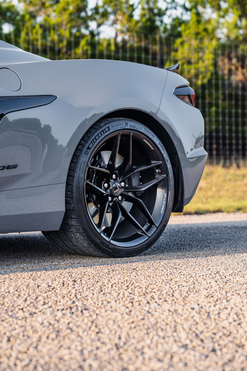 Sea Wolf Gray 2025 Chevrolet Corvette Z06 with gloss black multi-spoke rims and Michelin tires.