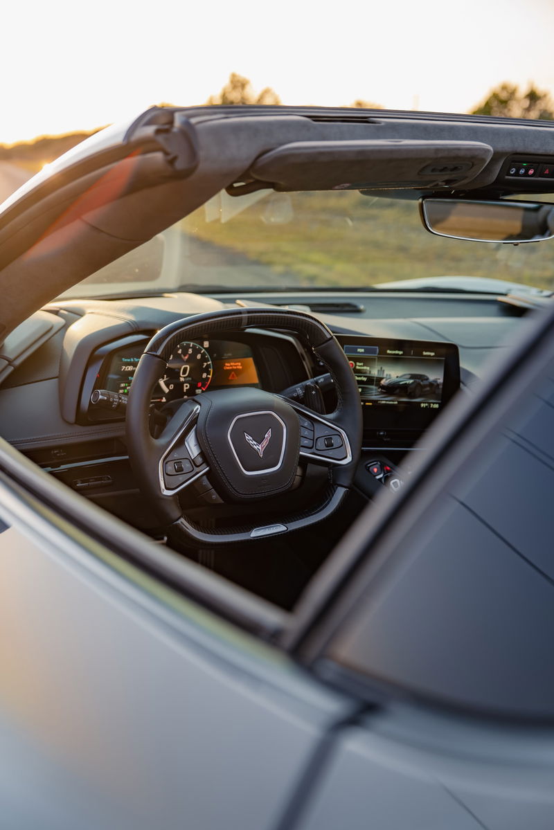 2025 Chevrolet Corvette Z06 interior in Sea Wolf Gray. Digital dash, infotainment screen, steering wheel.