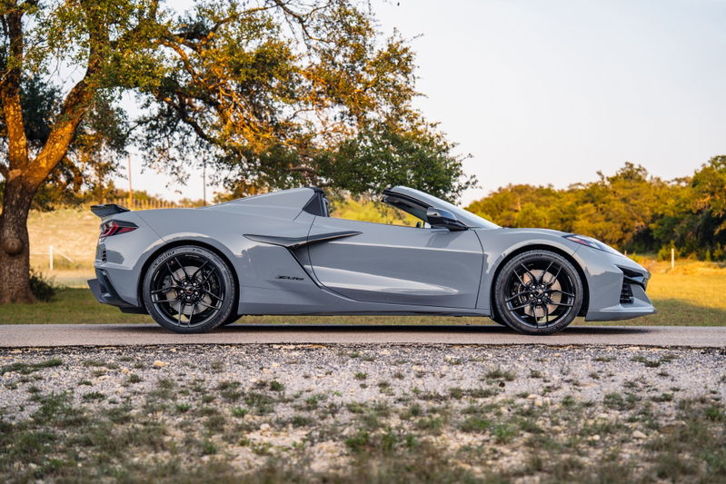 2025 Chevrolet Corvette Z06 in Sea Wolf Gray, black rims, black spoiler.