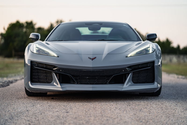 Front view of a Sea Wolf Gray 2025 Chevrolet Corvette Z06. Aggressive front fascia with black trim and large air intakes.