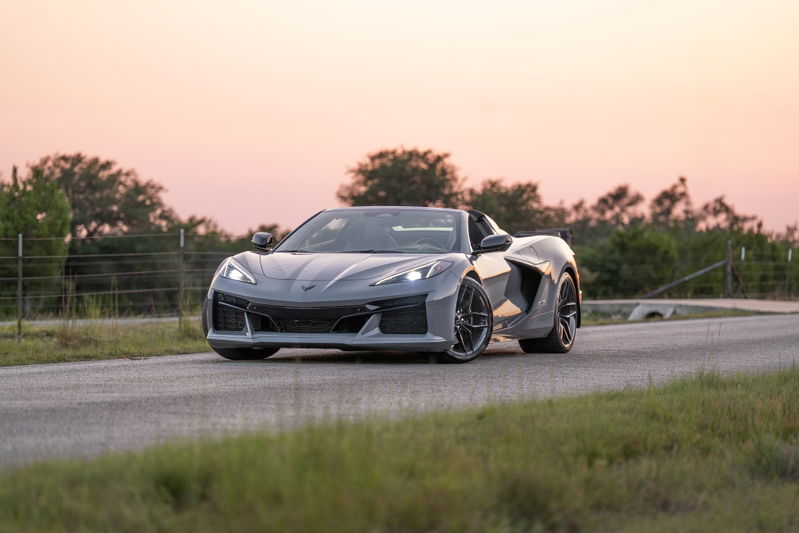 2025 Chevrolet Corvette Z06 convertible in Sea Wolf Gray with performance rims at sunset.
