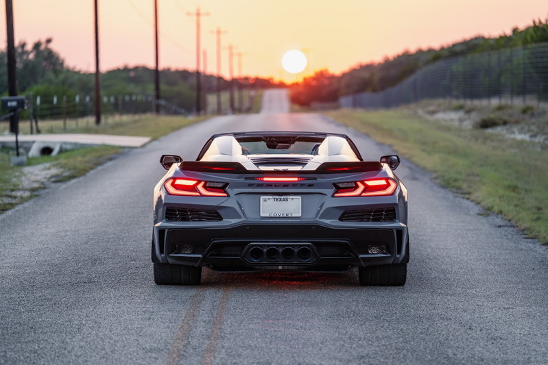 2025 Sea Wolf Gray Chevrolet Corvette Z06 convertible rear view with quad exhaust tips and red LED tail lights.