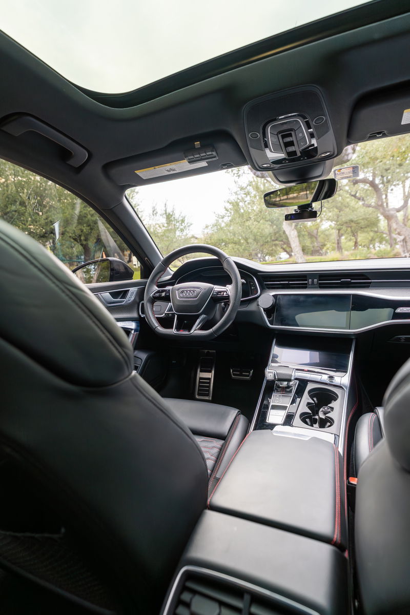 2022 Nardo Grey Audi RS6 interior with panoramic sunroof and touchscreen infotainment.