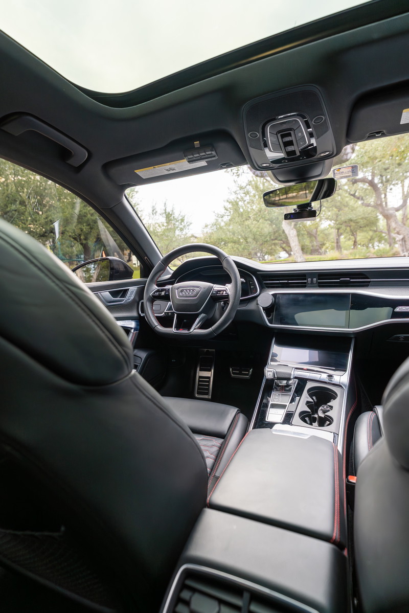2022 Nardo Grey Audi RS6 interior with panoramic sunroof and touchscreen infotainment.