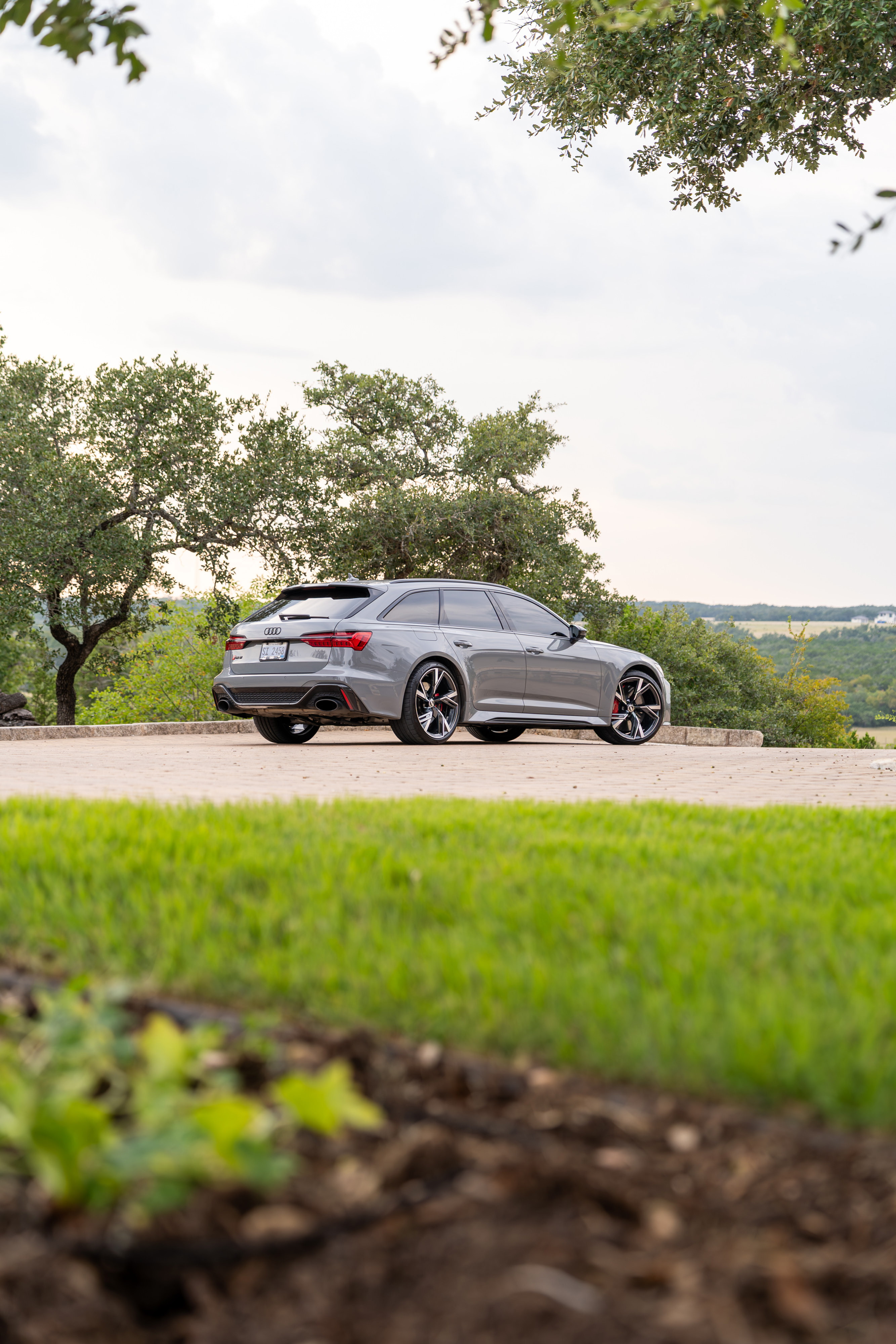 Nardo Grey 2022 Audi RS6 Avant with gloss black rims and red brake calipers.