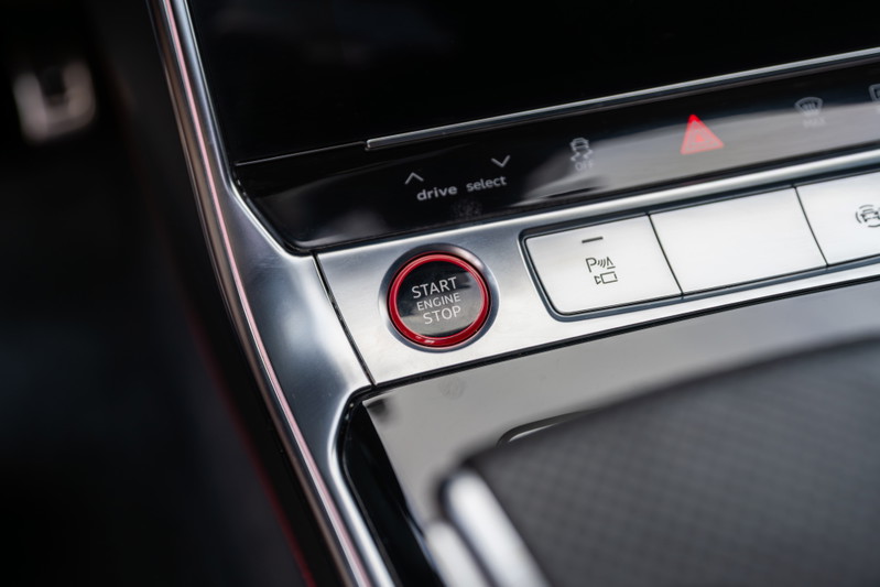 2022 Audi RS6 start/stop button with brushed aluminum trim and red accents.