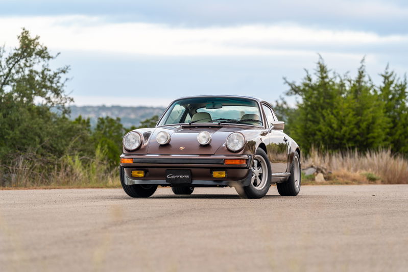 1975 Porsche 911 Carrera in Copper Brown Metallic, with fog lights and Fuchs rims.