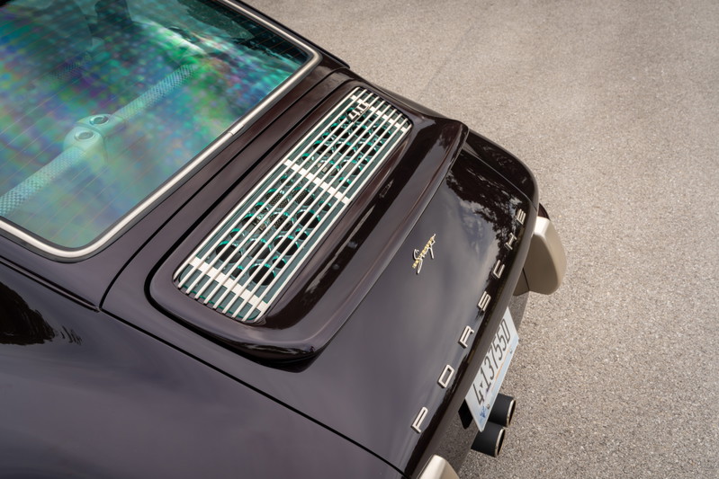 Aubergine metallic Singer 911 rear with chrome trim and exhaust pipes.