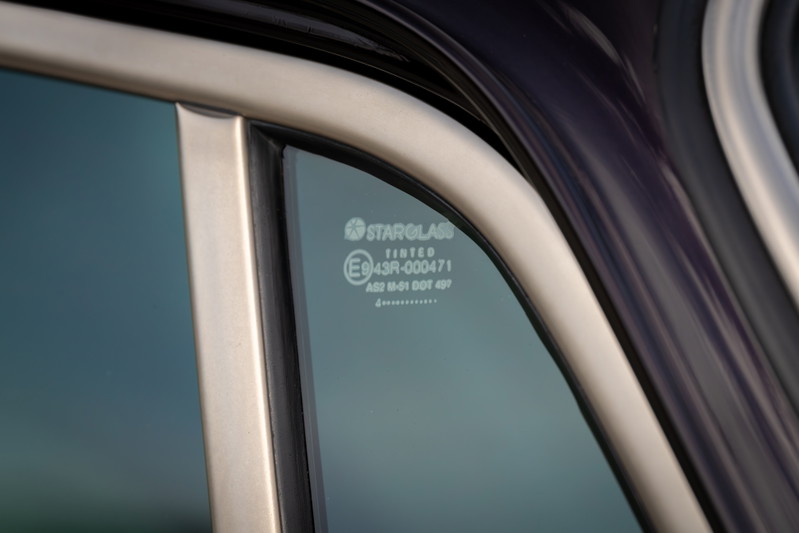 Close-up of a tinted Singer Porsche 911 window trim.