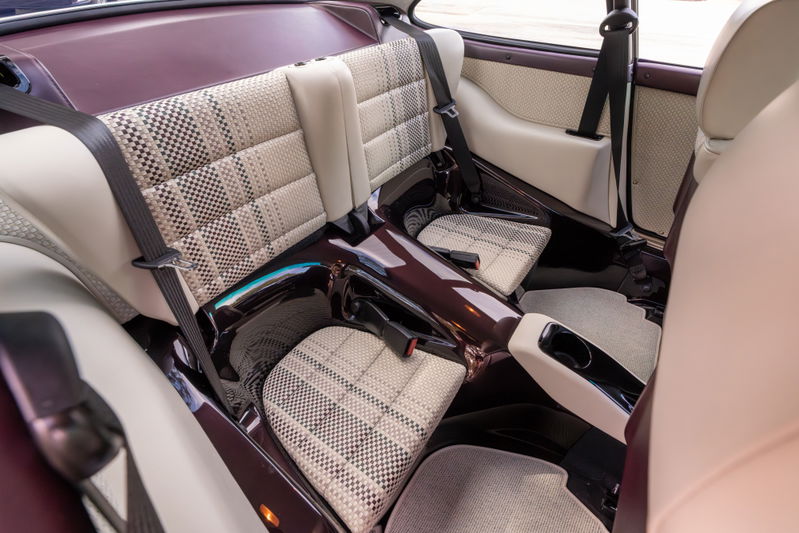 1990 Singer 911 aubergine metallic interior with houndstooth & cream plaid trim.