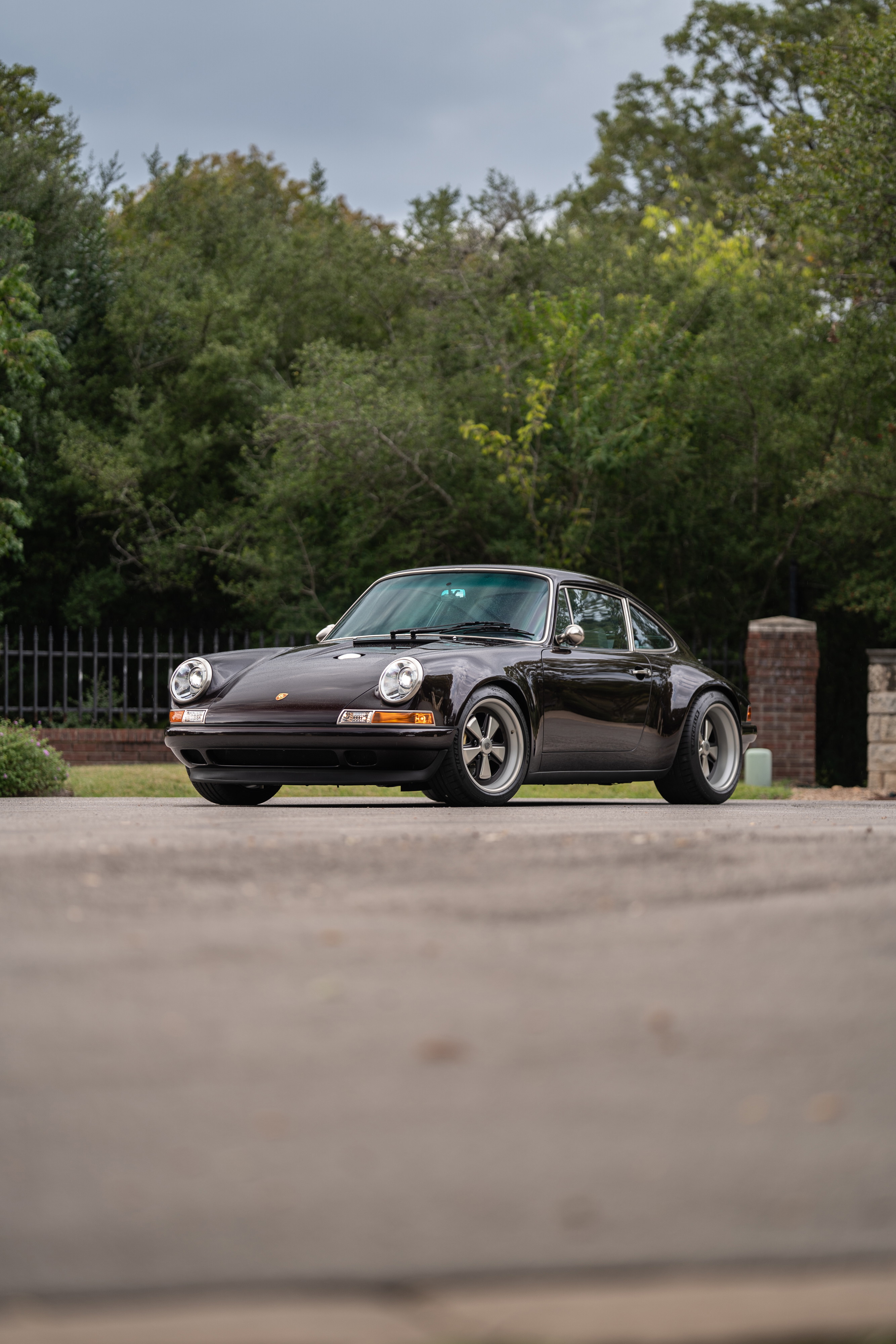 Aubergine Metallic 1990 Singer Porsche 911 with Fuchs-style rims.