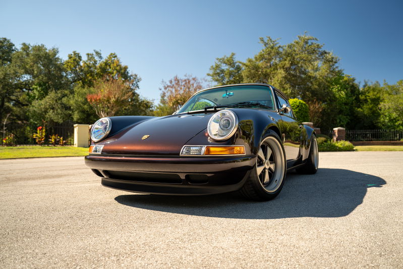 Aubergine Metallic Singer 911 with Fuchs-style rims and chrome trim.