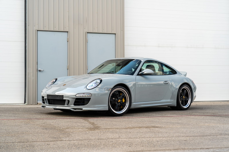 2010 Porsche 911 Sport Classic in Sport Classic Grey with black alloy rims and yellow brake calipers.