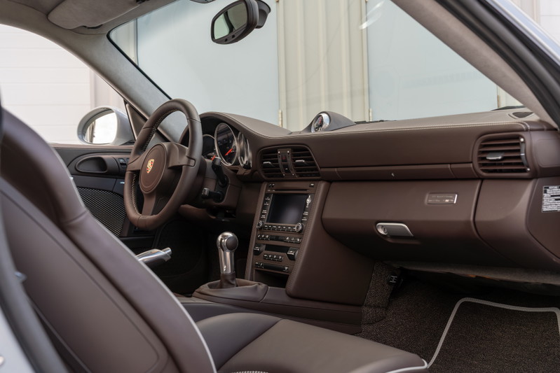 2010 Porsche 911 Sport Classic interior. Dark brown leather seats and dash trim.