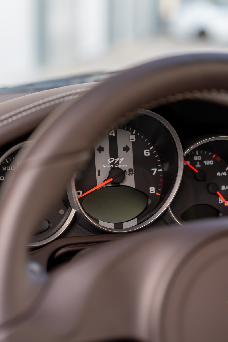 Close-up of the instrument cluster in a 2010 Porsche 911 Sport Classic.