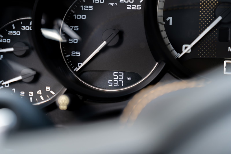 Close-up on the instrument cluster of a 2018 Porsche 911 Turbo S Exclusive Series, showing 53 miles.