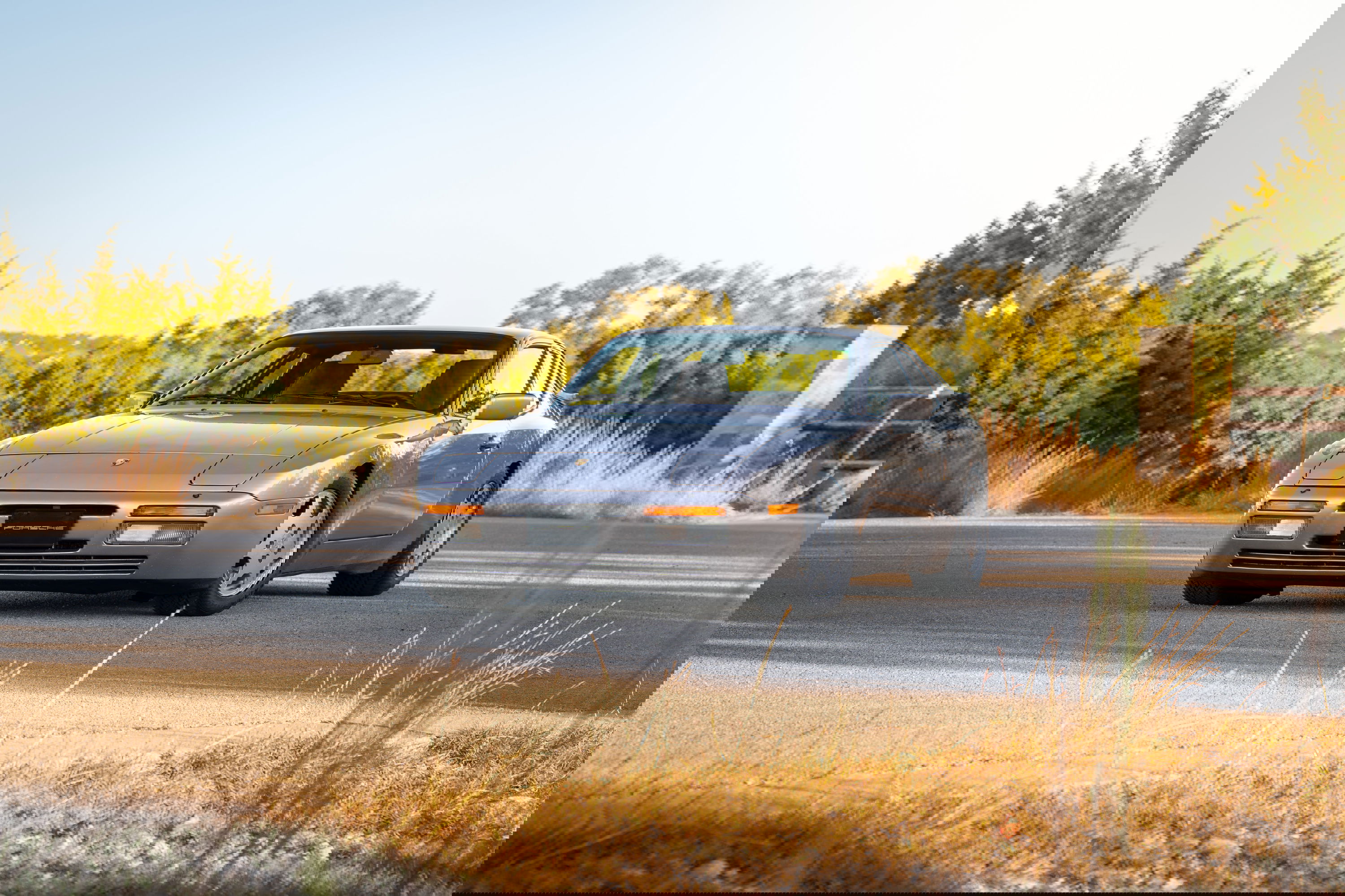 Silver 1987 Porsche 944 Turbo S coupe with alloy rims and black trim.