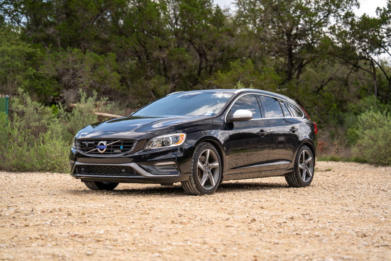 Black 2015 Volvo V60 R-Design Polestar with silver rims and trim.