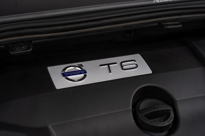 Volvo V60 T6 Polestar engine bay badge with carbon fiber trim.