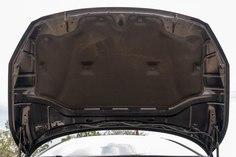Underhood insulation of a black 2015 Volvo V60 R-Design Polestar.