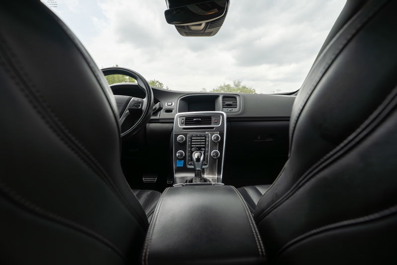Interior view of a black 2015 Volvo V60 R-Design Polestar, showing leather seats and dashboard.