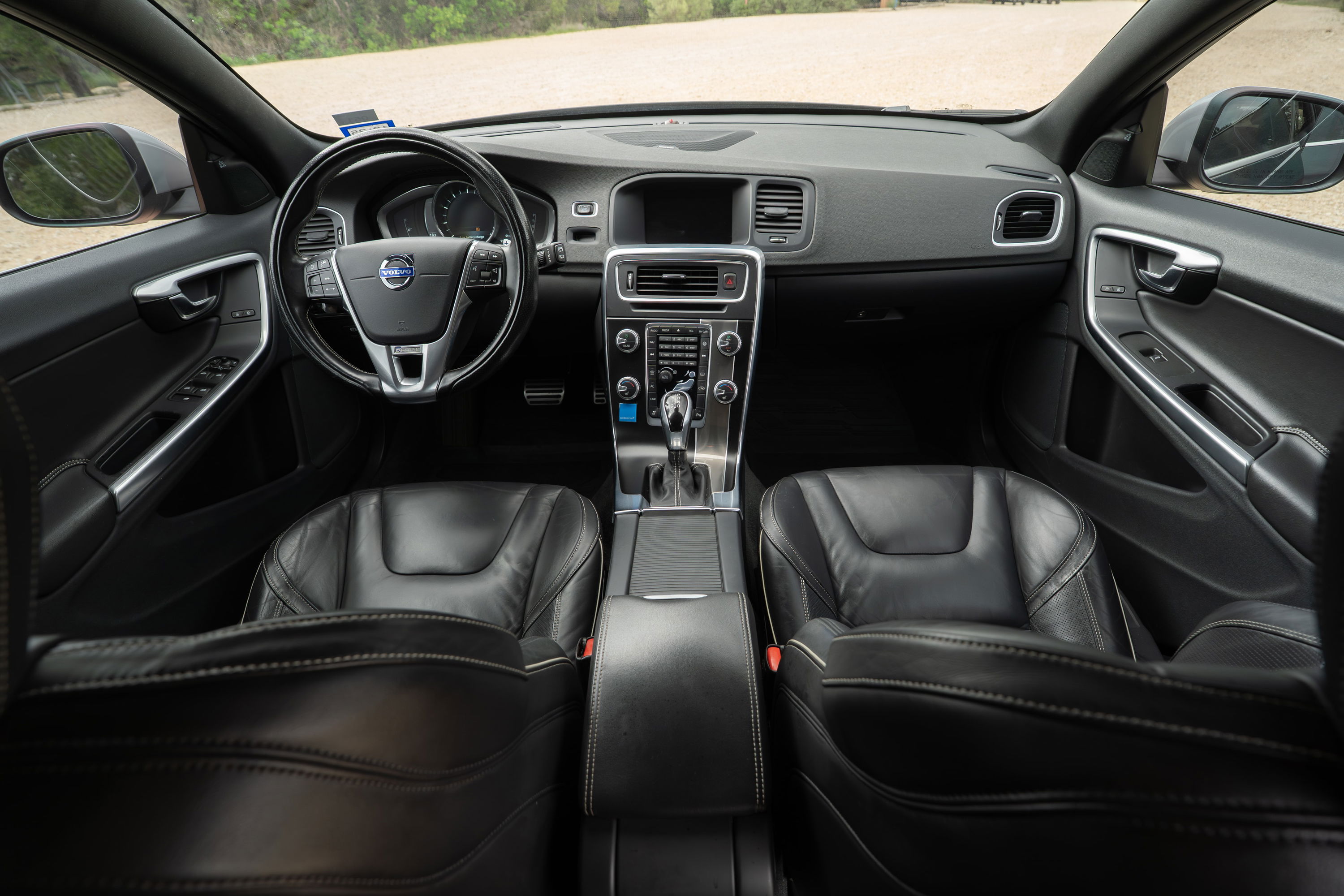 2015 Volvo V60 R-Design Polestar interior. Black leather seats, steering wheel, dash.