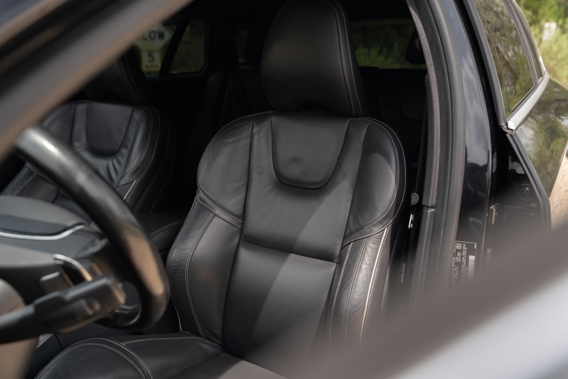 Black 2015 Volvo V60 R-Design Polestar interior. Leather sport seats, steering wheel.