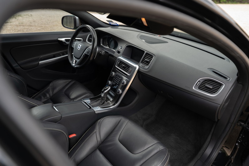 2015 Volvo V60 R-Design Polestar interior. Black leather seats, dashboard, center console.