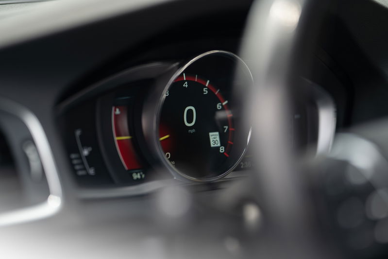 2015 Volvo V60 R-Design Polestar digital instrument cluster showing 0 mph and speed limit sign.