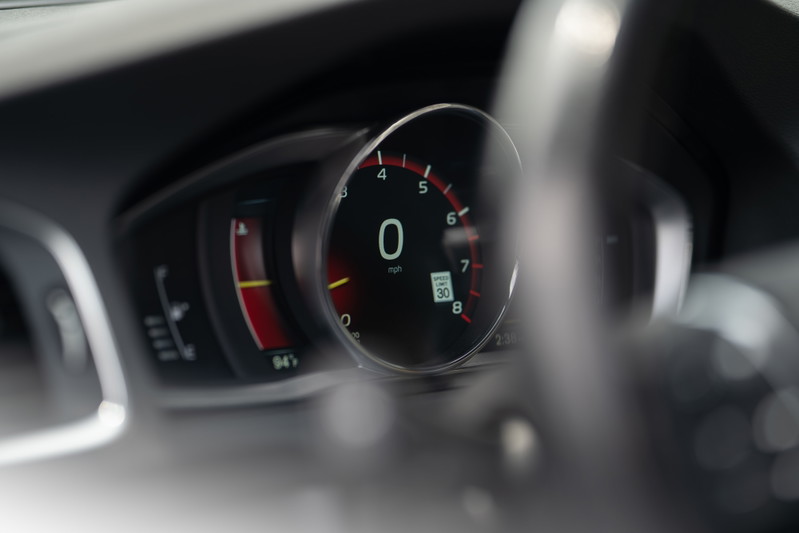 2015 Volvo V60 R-Design Polestar digital instrument cluster showing 0 mph and speed limit sign.