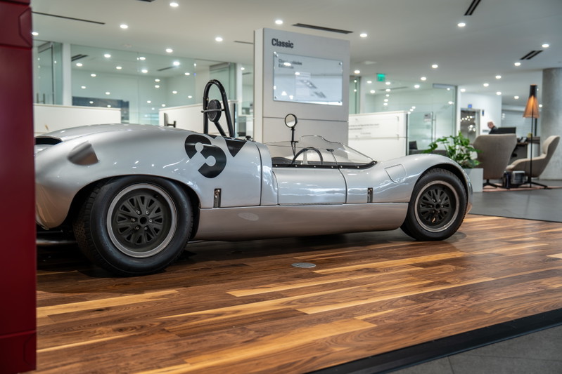 1964 Elva Porsche 4-Cam silver race car with black '35' livery and classic rims.