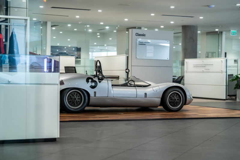 1964 Elva Porsche 4-Cam race car with black racing rims and side number 3 livery.