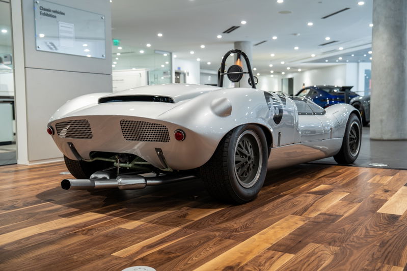 1964 Elva Porsche 4-Cam, silver, open-top race car with black rims.