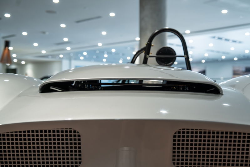 Close-up of a white 1964 Elva Porsche 4-Cam's hood scoop and grille.