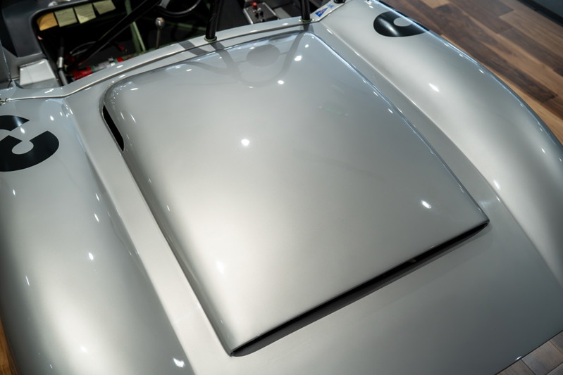 Close-up of the silver 1964 Elva Porsche 4-Cam hood, showing racing livery number 3.