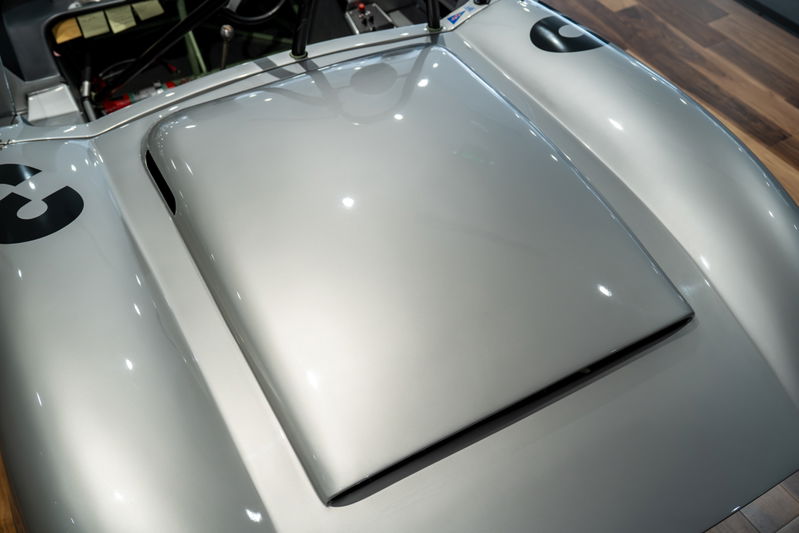 Close-up of the silver 1964 Elva Porsche 4-Cam hood, showing racing livery number 3.