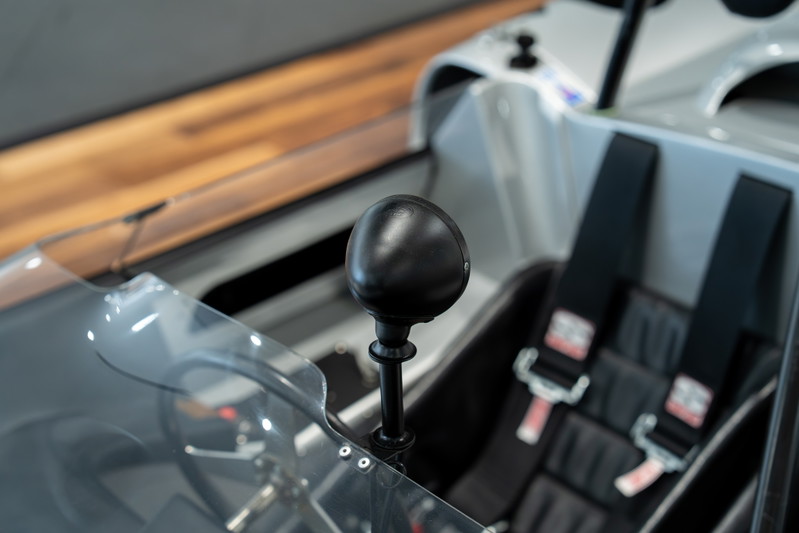 Close up of a 1964 Elva Porsche 4-Cam's shifter and racing seats.