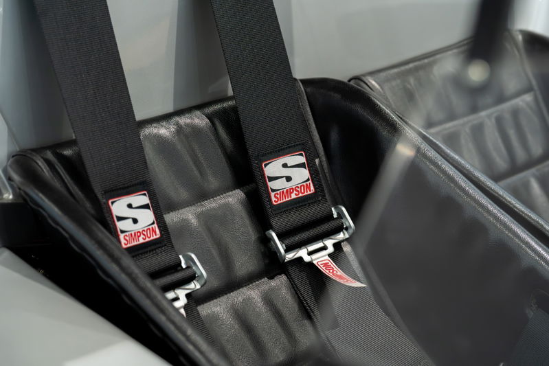 Black Simpson racing harnesses on bucket seats of a 1964 Elva Porsche 4-cam.