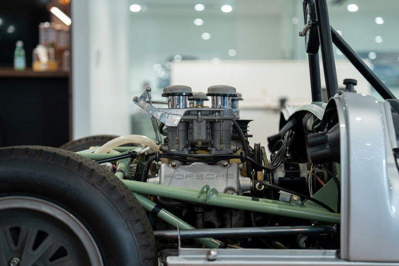 1964 Elva Porsche 4-Cam engine with dual carburetors and silver body trim.