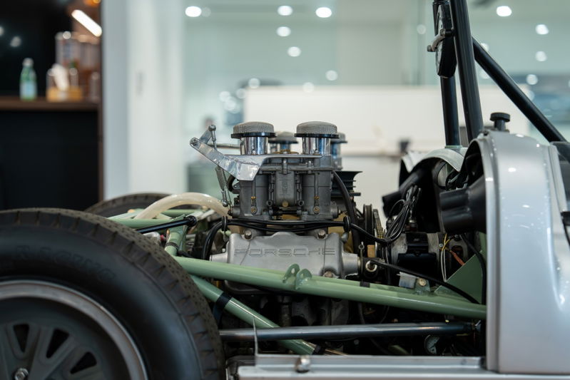 1964 Elva Porsche 4-Cam engine with dual carburetors and silver body trim.