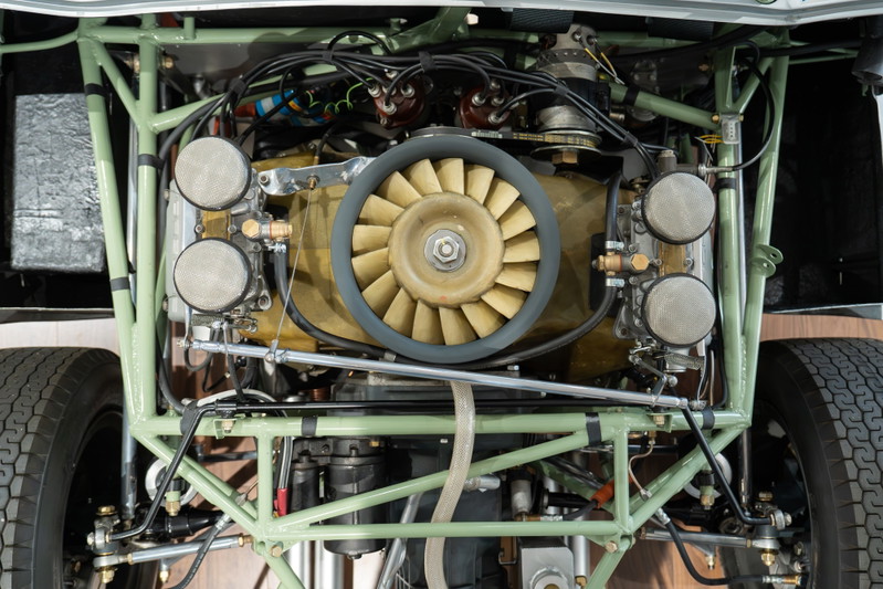 1964 Elva Porsche 4-Cam engine with cooling fan, carburetors, and tubular chassis.