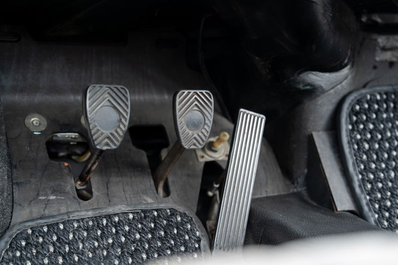 1965 Porsche 912 interior: clutch, brake, and gas pedals with textured rubber and aluminum trim.