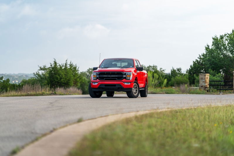 Red 2022 Ford F-150 Roush with aggressive trim and off-road wheels.
