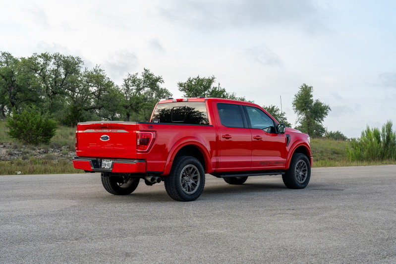 Red 2022 Ford F-150 Roush with dark gray rims and black trim.