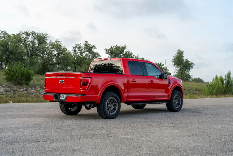 Red 2022 Ford F-150 Roush with dark gray rims and black trim.