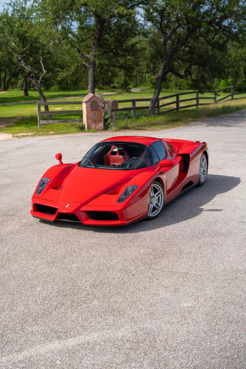 Red 2003 Ferrari Enzo with silver alloy rims.