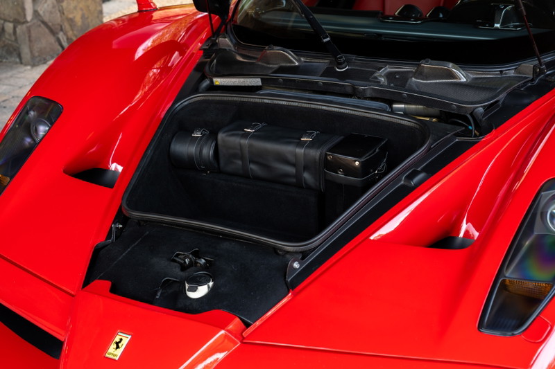 2003 Ferrari Enzo front trunk with black leather luggage.