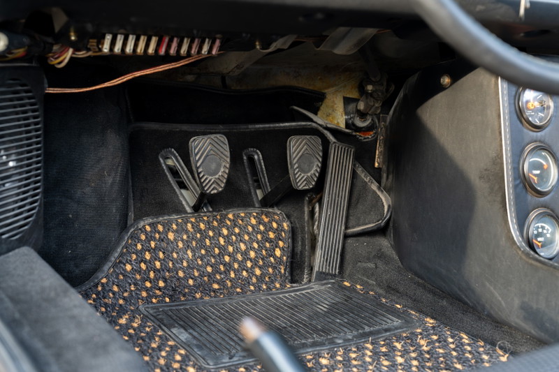 1974 Porsche 914 Can-Am pedals and dashboard with aftermarket floor mats.